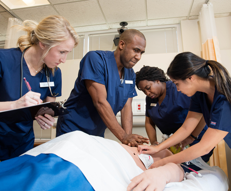 BSN students working on patient in simulation lab