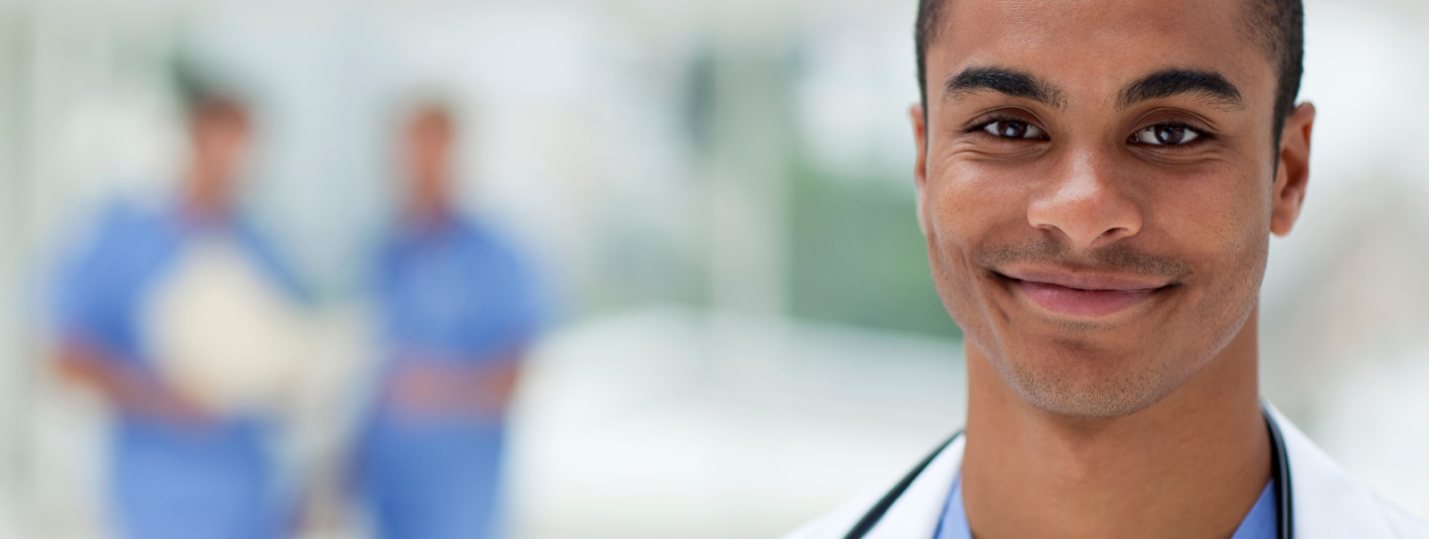 APRN smiling in hospital hallway